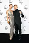 LONDON, ENGLAND - DECEMBER 02: Daniel Lee poses with Rosie Huntington-Whiteley in the winners room after accepting the Accessories Designer of the Year award on behalf of Bottega Veneta during The Fashion Awards 2019 held at Royal Albert Hall on December 02, 2019 in London, England. (Photo by Tim Whitby/BFC/Getty Images)