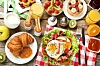Tasty breakfast on wooden table