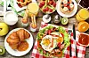Tasty breakfast on wooden table