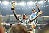 Lionel Messi lifts the trophy after Argentina win the World Cup