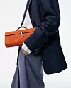 Najtraženiji model u prošlom kvartalu bio je Slim Symmetry Pochette - torbica koja spaja sofisticiran dizajn i funkcionalnost