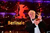 TOPSHOT - French director Nicolas Philibert poses with the ”Golden Bear for Best Film” for the film ”Sur l‘Adamant” (On the Adamant) after the awards ceremony of the 73rd Berlin International Film Festival Berlinale in Berlin, on February 25, 2023. (Photo by Tobias SCHWARZ/AFP)