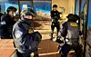 Law enforcement during a raid. (Credit: National Geographic)