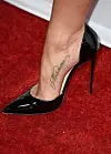 HOLLYWOOD, CA - JANUARY 14: Actress/Producer Jennifer Aniston (shoe and tattoo detail) attends the premiere of Cinelou Films'