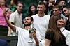 Croatia‘s Mate Pavic (L) takes a selfie photo with Tottenham Hotspur‘s Croatian midfielder Ivan Perisic (2L) beating Belgium‘s Joran Vliegen and China‘s Yifan Xu during the mixed doubles final tennis match on the eleventh day of the 2023 Wimbledon Championships at The All England Lawn Tennis Club in Wimbledon, southwest London, on July 13, 2023. (Photo by Adrian DENNIS/AFP)/RESTRICTED TO EDITORIAL USE