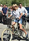 Brigitte Macron, wife of French President Emmanuel Macron, rides a bicycle at Le Touquet, northern France, on June 17, 2017. (Photo by Philippe HUGUEN/AFP)
