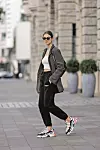 BERLIN, GERMANY - SEPTEMBER 06: Influencer Jacqueline Zelwis wearing white top by Zara, a drak grey Blazer by Zara, black Jogging pants by Onweeekends, multicolored sneakers by Balenciaga, a black bag by Pinko, sunglases by Gigi Studios and jewelry by Black Palms the Label during a street style shooting on September 6, 2020 in Berlin, Germany. (Photo by Streetstyleshooters/Getty Images)