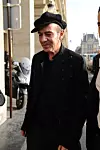 Rođen je u Gibraltaru, britanskoj enklavi u Španjolskoj, pravim imenom Juan Carlos Antonio Galliano-Guillén