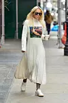 New York, NY - British singer Rita Ora enjoys her morning coffee and shares a cute smile with our cameras while exiting a NYC Hotel donning a knit turtleneck maxi dress and white sneakers. Pictured: Rita Ora *UK Clients - Pictures Containing Children Please Pixelate Face Prior To Publication*, Image: 407893996, License: Rights-managed, Restrictions: , Model Release: no, Credit line: North Woods / BACKGRID / Backgrid USA / Profimedia