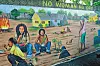 Jamaica, Surrey County, Parish of Kingston, Kingston, Bob Marley Museum, mural painted by the artist Jimmy Stewart featuring the traditional life of a village in Jamaica