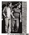 Chris Penn and Sean Penn looking around brick wall in a scene from the film 'At Close Range', 1986. (Photo by Orion/Getty Images)
