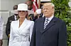 United States President Donald J. Trump and first lady of the United States Melania Trump emerge from the White House as the await the arrival of French President Emmanuel Macron and first lady of France Brigette Macron on the South Lawn of the White House during the French State Visit to the United States on April 24, 2018 in Washington, DC.