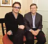 Bono (L), lead singer of the rock group U2, and Microsoft chairman Bill Gates sit together before a news conference at the World Economic Forum in New York, February 2, 2002. Gates teamed up with rock icon Bono in an appeal to world leaders to substantially increase funding for global health care. (Photo by Jeff Christensen/WireImage)