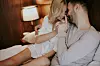 Loving couple on the bed in the bedroom