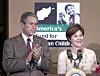 398344 01: President George W. Bush and his wife, First Lady Laura Bush attend a news conference December 8, 2001 at a Red Cross warehouse in New Windsor, Maryland where relief supplies for Afganistan's children are being stored before shipment. (Photo by Stephen J. Boitano/Getty Images)