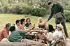 LEE, seated, center 4 from left: Josh O‘Connor as Antony Penrose (off white shirt), Noemie Merlant as Nusch Eluard, Marion Cotillard as Solange d‘Ayen, Kate Winslet as Lee Miller; standing: Alexander Skarsgard as Roland Penrose, 2023. ph: Kimberley French/? Roadside Attractions/courtesy Everett Collection