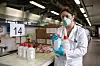 MILAN, ITALY - MARCH 19: A postdoctoral researcher, wearing gloves and a protective face mask, holds two bottles of hydrogen peroxide as she works inside the laboratory of Chemistry, Materials and Chemical Engineering 'Giulio Natta' at Politecnico di Milano on March 19, 2020 in Milan, Italy. Following the national shortage of hand sanitiser products due to the novel Coronavirus outbreak, Italy's largest technical university the Politecnico di Milano has started producing hand sanitiser to be delivered to the Protezione Civile, the Italian body dealing with the management of emergency events. The Italian government continues to enforce the nationwide lockdown measures to control the spread of COVID-19. (Photo by Emanuele Cremaschi/Getty Images)