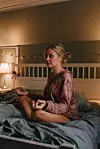 Real woman in pyjamas relaxing in bedroom meditating Photo taken indoors in bed unretouched photo with natural light