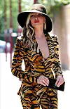 LONDON, UNITED KINGDOM - *EXCLUSIVE* - American model Caprice goes braless in a plunging tiger print power suit as she walks to a business meeting in London. *UK Clients - Pictures Containing Children Please Pixelate Face Prior To Publication*,Image: 540501985, License: Rights-managed, Restrictions: , Model Release: no, Credit line: BACKGRID / Backgrid UK / Profimedia