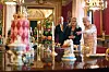 LONDON, ENGLAND - JULY 17: Queen Elizabeth II looks at a recreation of the 'Victoria' pattern dessert service in the State Dining Room, as part of the exhibition to mark the 200th anniversary of the birth of Queen Victoria for the Summer Opening of Buckingham Palace on July 17, 2019 in London, England. (Photo by Victoria Jones - WPA Pool/Getty Images)