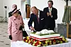 LONDON - MAY 5: Prince Philip, Duke of Edinburgh cuts a cake as Queen Elizabeth II looks on during a visit to The Royal Botanic Gardens in Kew on May 5, 2009 in London, England. The Royal Botanic Gardens at Kew was celebrating it's 250th Anniversary. (Photo by Johnny Green - WPA Pool/Getty Images)