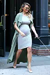 **NO AUSTRALIA** New York, NY - Chrissy Teigen is one fashionable mama and looks stunning showing off her baby bump in a gray body con dress and lace up heels. November 16, 2015,Image: 266478879, License: Rights-managed, Restrictions: NO Brazil, NO Australia, Model Release: no, Credit line: - / Backgrid USA / Profimedia