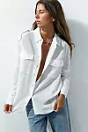 Bijela košulja s džepovima/Zara/229,90 KN
