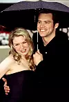 Renee Zellweger, Jim Carrey under an umbrella at the Golden Globe Awards, January, 2000,Image: 98333821, License: Rights-managed, Restrictions: For usage credit please use; Robert Hepler/Everett Collection, Model Release: no, Credit line: Robert Hepler Collection / Everett / Profimedia