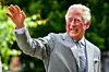 The Prince of Wales gestures to crowds of hospital staff watching from a distance as he chats with front line key workers who who have responded to the COVID-19 pandemic during a visit to Gloucestershire Royal Hospital.,Image: 532198938, License: Rights-managed, Restrictions: , Model Release: no, Credit line: Ben Birchall / PA Images / Profimedia
