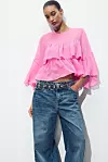 Zara bluza s volanima (25,95 eura)