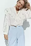 Zara bluza s volanima (29,95 eura)