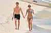 ** RIGHTS: WORLDWIDE EXCEPT IN ITALY, UNITED KINGDOM ** Turks and Caicos, TURKS AND CAICOS ISLANDS - *PREMIUM-EXCLUSIVE* - Taylor Swift and her boyfriend Joe Alwyn continue their romantic getaway at a Luxury Private resort in Turks and Caicos. The pair enjoyed some drinks on the beach as they held hands after taking a quick dip in the ocean. Taylor showed off her toned body in a blue and white striped bikini. *SHOT ON 07/05/18* Pictured: Taylor Swift and Joe Alwyn BACKGRID USA 9 JULY 2018,Image: 377343319, License: Rights-managed, Restrictions: , Model Release: no, Credit line: SBMF / BACKGRID / Backgrid USA / Profimedia