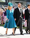 WINDSOR, UNITED KINGDOM - MAY 19: Peter Phillips and wife Autumn Phillips arrive at St George's Chapel at Windsor Castle before the wedding of Prince Harry to Meghan Markle on May 19, 2018 in Windsor, England. (Photo by Gareth Fuller - WPA Pool/Getty Images)