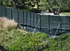 Beverly Hills, CA - *EXCLUSIVE* - A black screen is completed across Tyler Perry’s million Beverly Hills mansion, now reportedly the home of Prince Harry, his wife Meghan Markle and their baby son, Archie. The screen, pictured here from public hiking trails, now almost spans the entire rear of the mansion. A hiker there on Tuesday (May 12), a local mom, 44, of an 11-year-old boy, said: “The screen looks ugly. It’s out of character with the area. I can’t believe they were allowed to put it up. It’s surrounded by homes worth millions and no-other property has anything like it, it looks cheap and nasty. There are A-list celebrities who live nearby, they must be appalled at how this looks.” A half-naked man was also seen taking selfies on a trail that leads up a hill to the perimeter of the house on Tuesday afternoon. BACKGRID USA 12 MAY 2020,Image: 518941859, License: Rights-managed, Restrictions: , Model Release: no, Credit line: BACKGRID / Backgrid USA / Profimedia