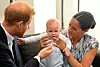 CAPE TOWN, SOUTH AFRICA - SEPTEMBER 25: Prince Harry, Duke of Sussex and Meghan, Duchess of Sussex tend to their baby son Archie Mountbatten-Windsor at a meeting with Archbishop Desmond Tutu at the Desmond & Leah Tutu Legacy Foundation during their royal tour of South Africa on September 25, 2019 in Cape Town, South Africa. (Photo by Toby Melville - Pool/Getty Images)