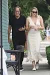 West Hollywood, CA - *EXCLUSIVE* - Real estate mogul Mohamed Hadid, 70, and Polish model Justyna Monde, 25, are spotted having a romantic lunch at Petrossian restaurant in West Hollywood. Hadid, who was previously engaged to Shiva Safai, allegedly began an affair with Monde while still engaged, according to Monde, who bears a striking resemblance to Hadid's daughter, model Gigi Hadid. The couple looked quite cozy during lunch, leaning in close to each other with Mohamed putting his arm around Justyna's shoulders at one point. After lunch, Mohamed stopped for some quick photos with fans and looked very happy, with a huge smile on his face! BACKGRID USA 15 SEPTEMBER 2019,Image: 471074671, License: Rights-managed, Restrictions: Please double check if it is Justyna Monde, Model Release: no, Credit line: KNNG / BACKGRID / Backgrid USA / Profimedia