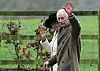 Britain‘s King Charles III and Britain‘s Queen Camilla waves as they leave after attending a service at St Mary Magdalene Church on the Sandringham Estate in eastern England on February 11, 2024. Britain‘s King Charles III on Saturday expressed his ”heartfelt thanks” to well-wishers, in his first statement since his shock announcement that he has cancer. (Photo by JUSTIN TALLIS/AFP)