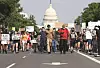 WASHINGTON, DC - JUNE 03: Demonstrators march down Pennsylvania Avenue near the Trump International Hotel during a protest against police brutality and the death of George Floyd, on June 3, 2020 in Washington, DC. Protests in cities throughout the country have been been held after the death of George Floyd, a black man who was killed in police custody in Minneapolis on May 25. (Photo by Tasos Katopodis/Getty Images)