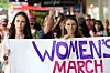 AUCKLAND, NEW ZEALAND - JANUARY 21: Labour MP Jacinda Ardern (L) and musician, writer, activist Lizzie Marvelly (C) join thousands of people marching up Queen Street on January 21, 2017 in Auckland, New Zealand. The marches in New Zealand were organised to show solidarity with those marching on Washington DC and around the world in defense of women's rights and human rights. (Photo by Fiona Goodall/Getty Images)