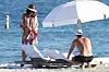*PREMIUM EXCLUSIVE* Cindy Crawford and husband, Rande Gerber look relaxed as they hit the beach on New Year's Day in Miami. Supermodel Cindy, 53, looked stunning with a shawl over a green bikini, topping off her chic look with a straw fedora. 01 Jan 2020, Image: 490681548, License: Rights-managed, Restrictions: World Rights, Model Release: no, Credit line: BackGrid/MEGA / Mega Agency / Profimedia