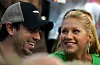 LOS ANGELES - JULY 13: Tennis player Anna Kournikova and singer Enrique Iglesias watch Andre Agassi play against Alex Bogomolov, Jr. during day 2 of the Mercedes-Benz Cup on July 13, 2004 at the Los Angeles Tennis Center at UCLA in Los Angeles, California. (Photo by Ronald Martinez/Getty Images)