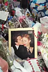 A photo of John F. Kennedy Jr and his wife Carolyn Bessette Kennedy is surrounded by balloons and flowers at a makeshift shrine in front of their apartment building in New York City 21 July 1999. The body of John F. Kennedy, Jr has been located and removed from the wreckage of the small plane he was flying with his wife Carolyn Bessette Kennedy and her sister Lauren G. Bessette on 16 July off the coast of Martha‘s Vineyard.,Image: 68782776, License: Rights-managed, Restrictions:, Model Release: no, Credit line: HENNY RAY ABRAMS/AFP/Profimedia