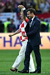 MOSCOW, RUSSIA - JULY 15: Croatia's President Kolinda Grabar-Kitarovic and French President Emmanuel Macron salute the crowd following the 2018 FIFA World Cup Final between France and Croatia at Luzhniki Stadium on July 15, 2018 in Moscow, Russia. (Photo by Dan Mullan/Getty Images)