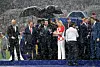 MOSCOW, RUSSIA - JULY 15: Vladimir Putin, President of Russia, Emmanuel Macron, President of France and Kolinda Grabar-Kitarovic, President of Croatia reacts to the rain while they wait to hand out medals during the 2018 FIFA World Cup Final between France and Croatia at Luzhniki Stadium on July 15, 2018 in Moscow, Russia. (Photo by Matthias Hangst/Getty Images)