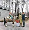 President John F Kennedy with his wife, First Lady Jacqueline Bouvier Kennedy, as their daughter, Caroline, sits atop a pony and their son, John Jr. holds his arms out, 1963 (JFK Library) *** Local Caption *** 01149491,Image: 167244727, License: Rights-managed, Restrictions: For Editorial Use Only -, Model Release: no, Credit line: United Archives/Topfoto/Topfoto/Profimedia
