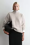 COS pulover s ovratnikom (99 eura)