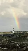 Svjetionik Kampen na otoku Sylt i prekrasna duga na nebu