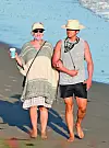 Santa Barbara, CA - *PREMIUM-EXCLUSIVE* - Katy Perry and Orlando Bloom soak up the sun on a rare appearance in Santa Barbara. The heavily pregnant songstress and her leading man took a late-afternoon beach stroll in matching straw hats. Katy covered her bump in a poncho as the two walked their dog along the golden sand without a care in the world. *Shot on July 5, 2020* *UK Clients - Pictures Containing Children Please Pixelate Face Prior To Publication*,Image: 540630477, License: Rights-managed, Restrictions: RIGHTS: WORLDWIDE EXCEPT IN UNITED KINGDOM, Model Release: no, Credit line: Clint Brewer Photography / BACKGRID / Backgrid USA / Profimedia