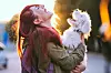 Attractive Redheaded Girl and White Puppy Smiling Together
