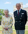 Queen Elizabeth II and the Duke of Edinburgh in the quadrangle at Windsor Castle, in a new photograph released to celebrate the Duke's 99th Birthday. The Queen is wearing an Angela Kelly dress with the Cullinan V diamond brooch. The Duke is wearing a Household Division tie. Picture: Pool / i-Images,Image: 529823829, License: Rights-managed, Restrictions: UK OUT. End users shall not licence, sell, transmit, or otherwise distribute any photographs represented by eyevine, to any third party. Contact eyevine for more information: Tel: +44 (0) 20 8709 8709 Email: info@eyevine.com, Model Release: no, Credit line: i-Images / Eyevine / Profimedia